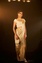 Load image into Gallery viewer, Saia metallic slit saree with an embellished pearl blouse will definitely make you look sassy and elegant in an event.  Tailored to perfection in a metallic fabric, the saree features a slit from the waist level and has an attached palla which creates a great fall.  It comes with a pearl embellished blouse with cap sleeves and deep from the back.